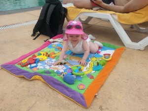 C on mat by the pool