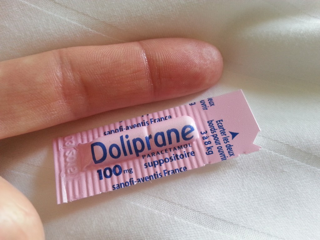 Doliprane suppository for a 3-8kg baby (my finger next to it for scale)