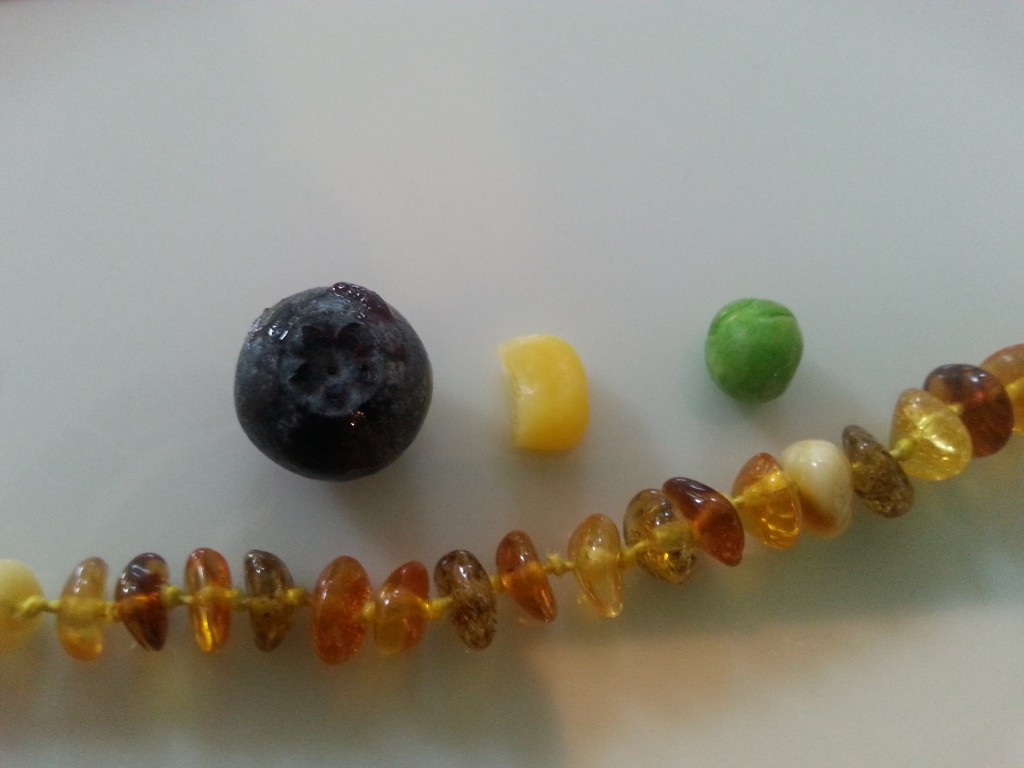 Compare the size of the beads next to a blueberry, sweetcorn and pea