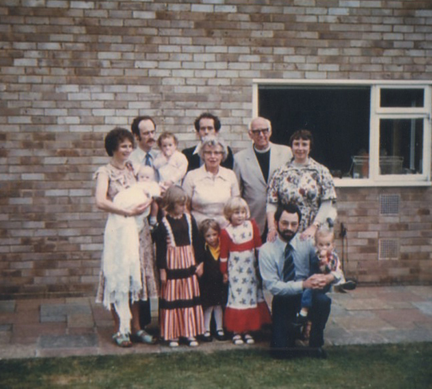 My brother's christening in 1978 with Grandad, who christened him, in the top right. (I'm the suck-a-thumb in my dad's arms, age 2 and 1/2.)