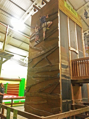 Father and daughter on climbing wall www.FranglaiseMummy.com