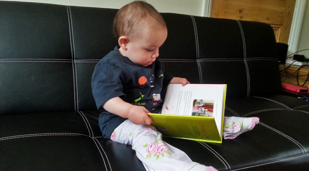Toddler reading on sofa l Why it's good to ignore your kids l www.FranglaiseMummy.com l French and English Parenting and Lifestyle Ramblings