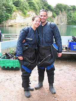 A couple in diving dry suits